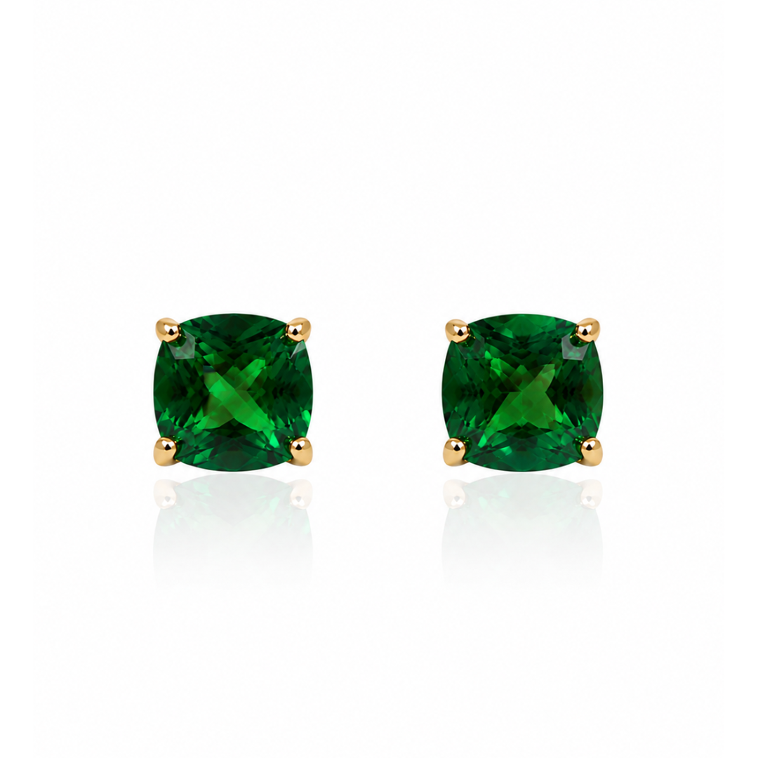 green stud earrings on a white background